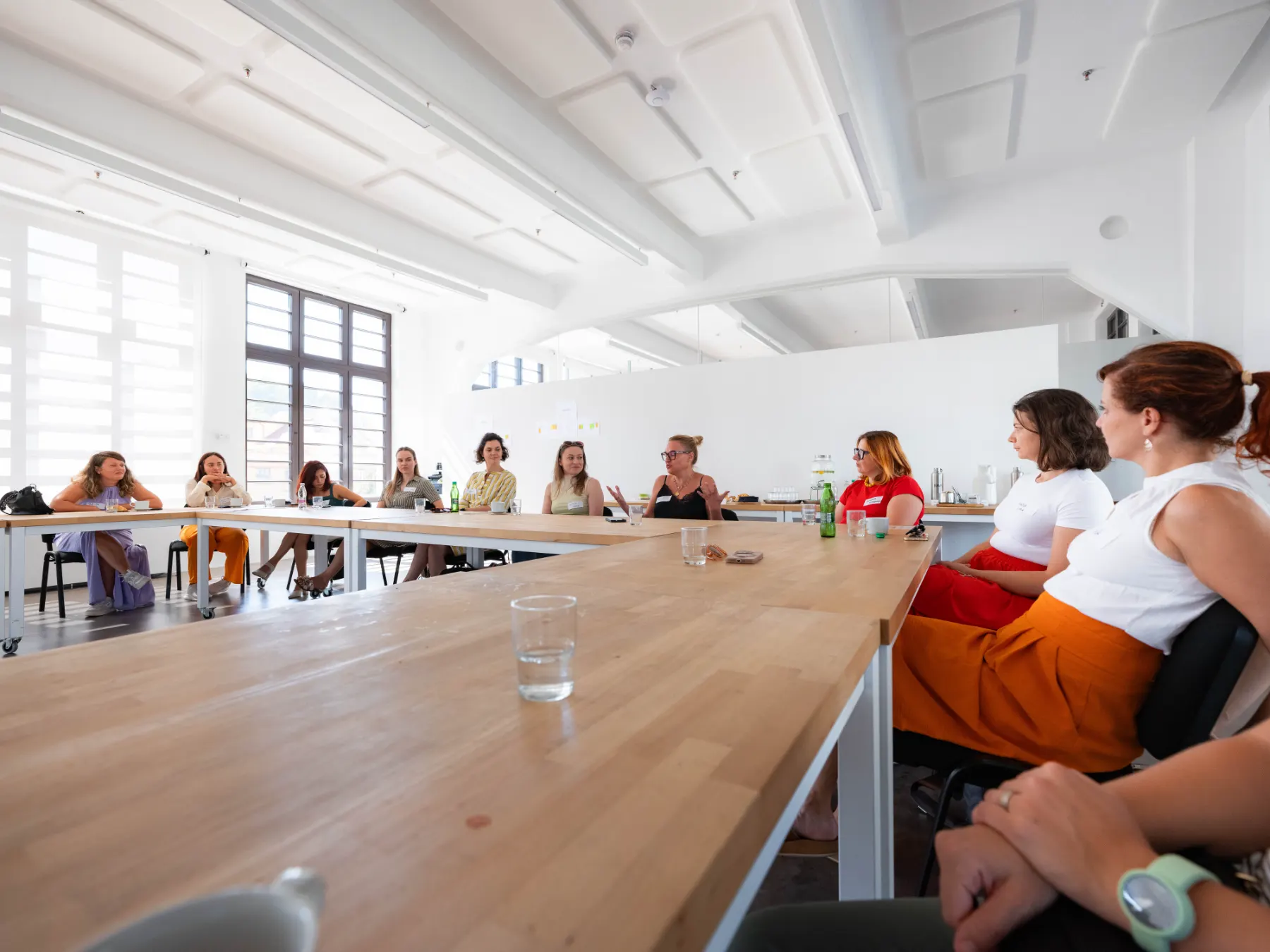 Members gathered around tables at a Zorya AI meetup in Ljubljana