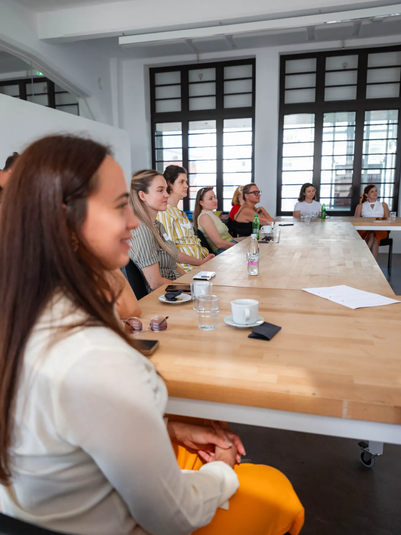 Members listening during a Zorya AI session in Ljubljana